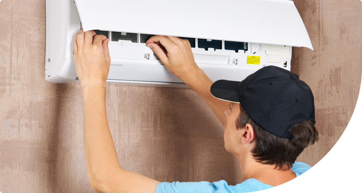 AC technician performing inspection